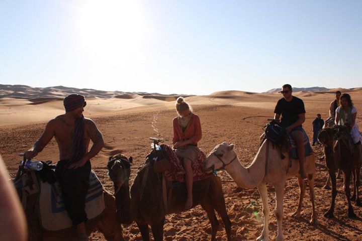Camel riding to our Berber camp in the Sahara Desert